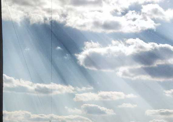 Photograph of the rays of sunlight.  Added rays of light in Adobe Photoshop.